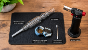 Nectar collector dab straw setup on wooden table with butane torch, silicone wax container, and cotton swab cleaning supplies — complete guide visual